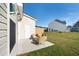 Back patio with outdoor seating looking out onto the yard, ideal for backyard relaxation at 827 Alma Square Dr, Moncks Corner, SC 29461