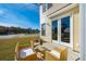 Patio area with outdoor seating and glass door entry, perfect for relaxing or entertaining at 827 Alma Square Dr, Moncks Corner, SC 29461