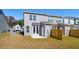 A backyard offers a concrete patio and manicured lawn at 829 Alma Square Dr, Moncks Corner, SC 29461