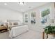 Cozy bedroom with neutral tones, a comfortable bed, and three large, bright windows at 829 Alma Square Dr, Moncks Corner, SC 29461