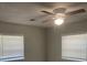 A bedroom featuring a ceiling fan, two windows and neutral walls at 8392 Herbert Smalls Rd, Edisto Island, SC 29438