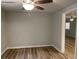 Neutral bedroom with ceiling fan and wood flooring at 8392 Herbert Smalls Rd, Edisto Island, SC 29438