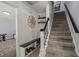 Stylish entryway with a staircase, built-in bench, and decorative accents at 8524 Belford Ct, North Charleston, SC 29420