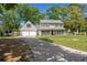 Two-story home with a welcoming front porch, two-car garage, and a spacious front lawn at 8524 Belford Ct, North Charleston, SC 29420