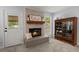 Charming fireplace area with a cozy bench and natural light from the window at 8524 Belford Ct, North Charleston, SC 29420