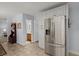 Kitchen featuring tile floors, stainless steel refrigerator, and views to other areas at 8524 Belford Ct, North Charleston, SC 29420