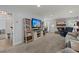 Spacious living room featuring a fireplace, entertainment center, and comfortable furniture at 8524 Belford Ct, North Charleston, SC 29420