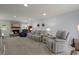 Cozy living room with a fireplace, comfortable seating, and plenty of natural light at 8524 Belford Ct, North Charleston, SC 29420