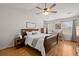 Tranquil main bedroom featuring vaulted ceilings, wood floors, and ample natural light at 8524 Belford Ct, North Charleston, SC 29420