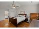 Bright main bedroom featuring vaulted ceilings, wood floors, and ample closet space at 8524 Belford Ct, North Charleston, SC 29420