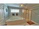 Bright bathroom features a soaking tub and separate glass-enclosed shower at 855 Hunt Club Run, Charleston, SC 29414