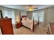 Bedroom featuring a four poster bed, ceiling fan and two windows at 855 Hunt Club Run, Charleston, SC 29414