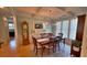Classic dining room with a coffered ceiling, hardwood floors, traditional furniture and ample natural light at 855 Hunt Club Run, Charleston, SC 29414