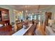 Open-concept dining room with hardwood floors, traditional furniture, and view into the living room at 855 Hunt Club Run, Charleston, SC 29414
