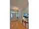 Bright foyer with hardwood floors, front door, chandelier, and view into the dining room at 855 Hunt Club Run, Charleston, SC 29414