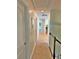 Long hallway featuring carpet flooring and neutral walls leading to various rooms in the home at 855 Hunt Club Run, Charleston, SC 29414