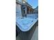 Relaxing hot tub with a view of the screened-in porch, ideal for unwinding after a long day at 855 Hunt Club Run, Charleston, SC 29414