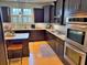 Well-equipped kitchen with modern appliances, dark wood cabinetry, granite countertops, and stainless steel double oven at 855 Hunt Club Run, Charleston, SC 29414