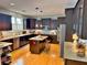 Modern kitchen with a center island, dark wood cabinets, granite countertops, and stainless steel appliances at 855 Hunt Club Run, Charleston, SC 29414