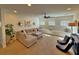 Spacious living room with a comfortable sectional sofa and built-in window seating at 855 Hunt Club Run, Charleston, SC 29414