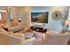 Cozy living room featuring comfortable seating, a decorative wall display, and ample natural light at 855 Hunt Club Run, Charleston, SC 29414