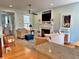 Comfortable living room featuring neutral-toned furniture, a fireplace, and an adjacent view of the kitchen at 855 Hunt Club Run, Charleston, SC 29414