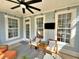 Relaxing screened porch featuring cozy chairs, a ceiling fan, and backyard views, great for outdoor living at 855 Hunt Club Run, Charleston, SC 29414