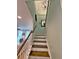 Stairway with wooden treads, white risers and handrail leading to an upper floor at 855 Hunt Club Run, Charleston, SC 29414