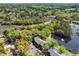 Aerial view showcases lush greenery, pond views, and neighboring houses at 880 Simpkins St # 2, Charleston, SC 29412