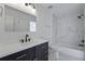 Contemporary bathroom featuring marble style tile, new vanity, and modern fixtures at 880 Simpkins St # 2, Charleston, SC 29412