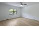 Bright, airy bedroom with a window, light walls, and modern ceiling fan provides a relaxing space at 880 Simpkins St # 2, Charleston, SC 29412