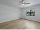 Bedroom featuring hardwood floors and a window overlooking the backyard at 880 Simpkins St # 2, Charleston, SC 29412