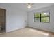 Bedroom featuring hardwood floors, a window overlooking the backyard, and ensuite bathroom at 880 Simpkins St # 2, Charleston, SC 29412