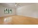 Spacious bedroom filled with natural light from a large window and featuring light hardwood floors at 880 Simpkins St # 2, Charleston, SC 29412