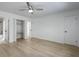Bright bedroom with hardwood floors, ceiling fan, multiple closets and bathroom access at 880 Simpkins St # 2, Charleston, SC 29412