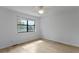Bedroom featuring hardwood floors and a window overlooking the backyard at 880 Simpkins St # 2, Charleston, SC 29412