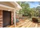 Cozy wooden deck with outdoor seating provides a relaxing space in a beautiful outdoor environment at 880 Simpkins St # 2, Charleston, SC 29412