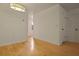 Dining area with hardwood floors, modern lighting fixture, and bright, neutral wall color at 880 Simpkins St # 2, Charleston, SC 29412