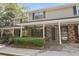 Attractive townhome with brick and siding exterior, covered porch, and well-maintained front yard at 880 Simpkins St # 2, Charleston, SC 29412