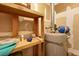 Basement storage space with wooden shelving and utilitarian water heater at 880 Simpkins St # 2, Charleston, SC 29412