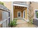 Backyard with a small patio and yellow siding at 9226 Southern Oak Ln, Ladson, SC 29456