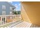 View from balcony overlooking neighboring buildings and fenced yards at 9226 Southern Oak Ln, Ladson, SC 29456
