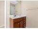 Traditional bathroom features a wood vanity, large mirror, and bright natural light at 9226 Southern Oak Ln, Ladson, SC 29456