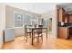 Dining area with hardwood floors, natural light, and a sliding glass door to a balcony at 9226 Southern Oak Ln, Ladson, SC 29456