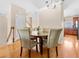 Cozy dining area with hardwood floors, a round table, and seating for four at 9226 Southern Oak Ln, Ladson, SC 29456