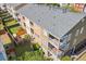 Overhead rear exterior view of townhomes showcasing balconies, patios, well-kept lawns, and fencing at 9226 Southern Oak Ln, Ladson, SC 29456