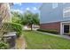 Home with a green lawn, neatly trimmed hedges, and a combination of siding and brick exterior at 9226 Southern Oak Ln, Ladson, SC 29456