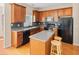 Well-equipped kitchen with an island, stainless steel appliances, and stylish backsplash at 9226 Southern Oak Ln, Ladson, SC 29456