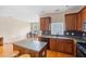 Functional kitchen featuring an island, wood cabinets, and modern appliances at 9226 Southern Oak Ln, Ladson, SC 29456