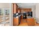 Well-lit kitchen featuring wood cabinets, modern appliances, and an island with granite countertops at 9226 Southern Oak Ln, Ladson, SC 29456